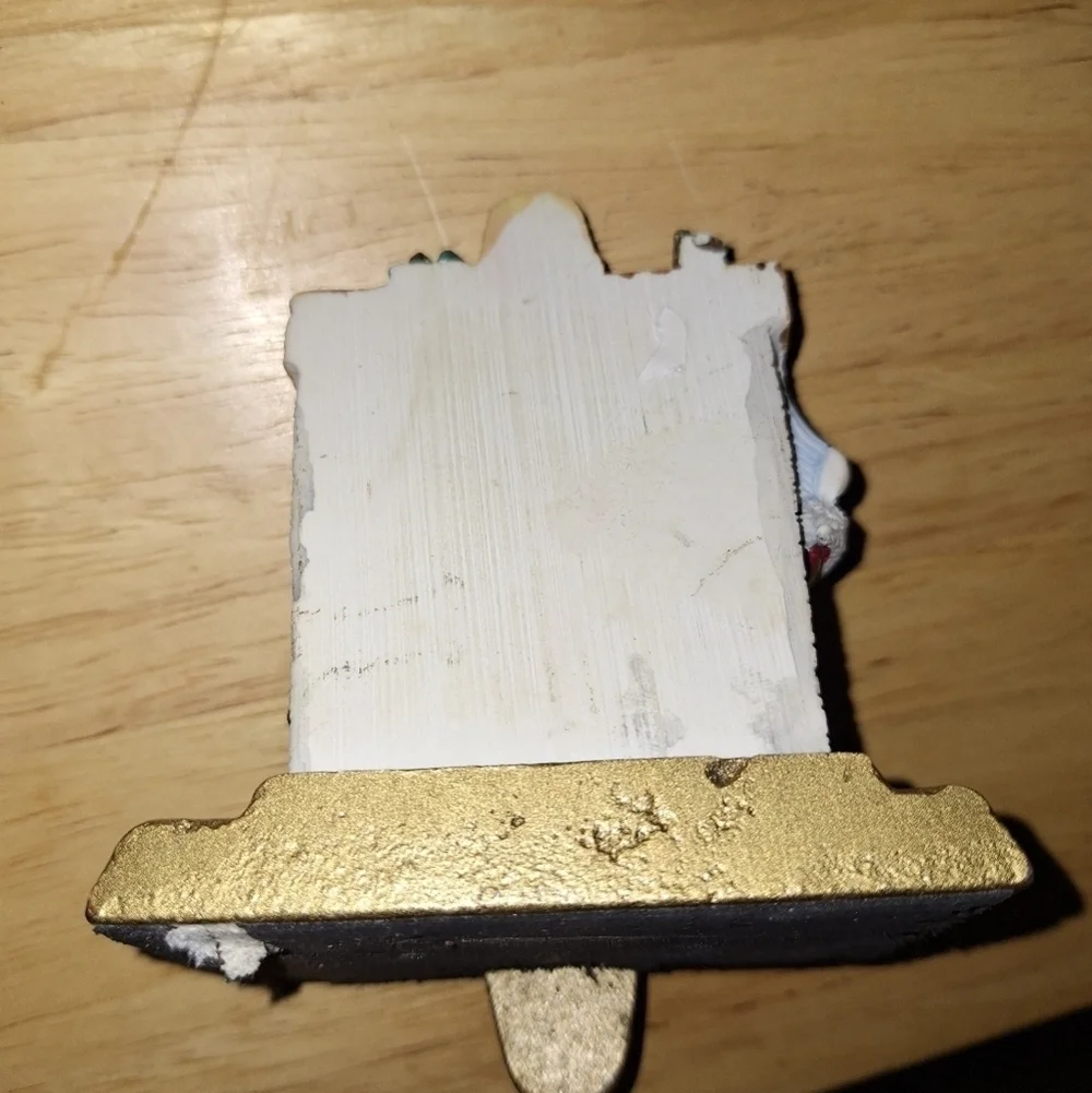 An unbranded Santa Clause Stocking Holder. Its base is 3.75